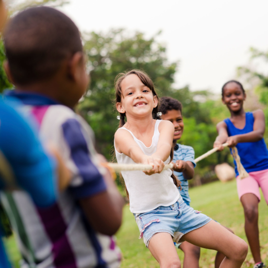 Kids playing tug a war for summer