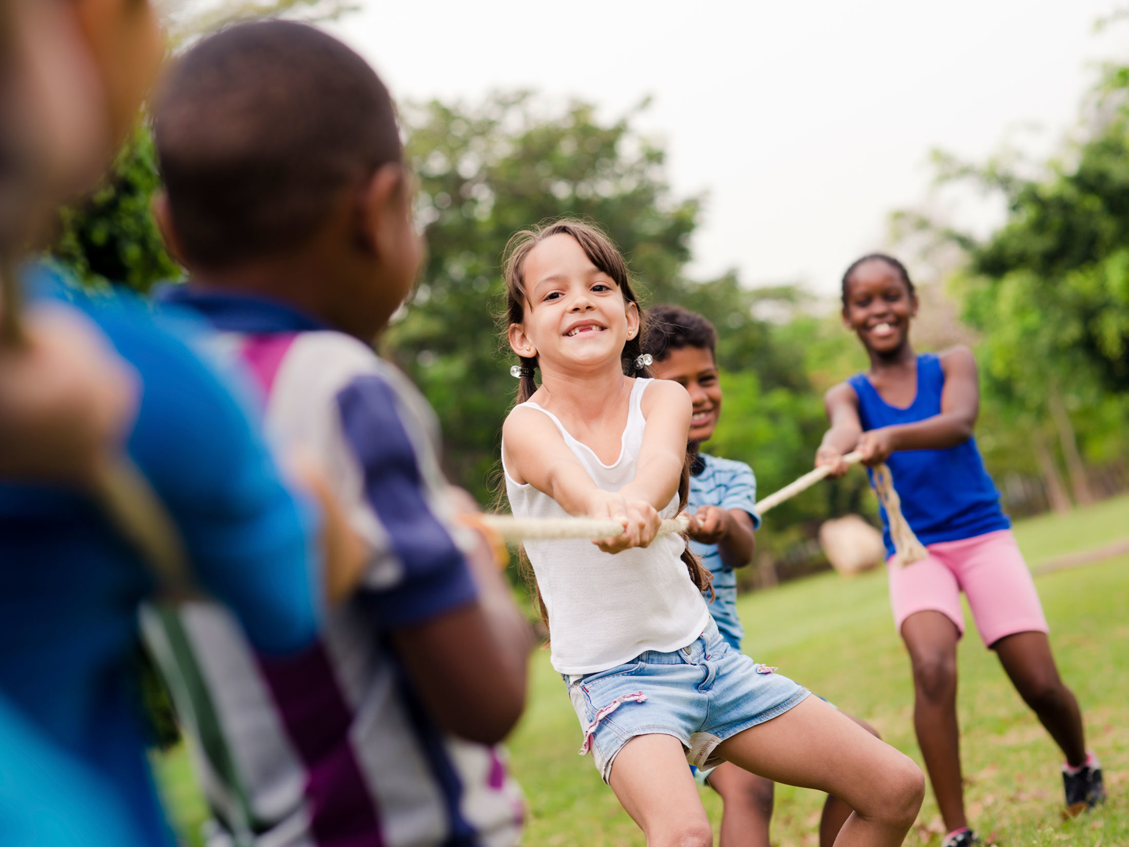 Kids playing tug a war for summer